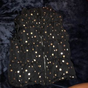 Black vest with gold stars